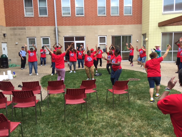 Residents and staff exercising together