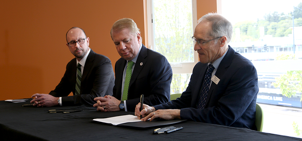 The ceremonial signing of the letter of intent (LOI) (from left), with Bill Hilf, CEO of Vulcan Inc., Ed Murray, Seattle Mayor, and Bill Rumpf, MHNW President.