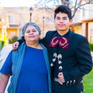 Roberta and her son Roberto stand outside Villa Madera